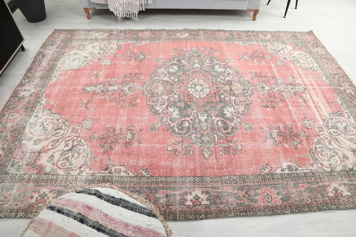 Full overhead view of the vintage rug, showing its complete design in a room