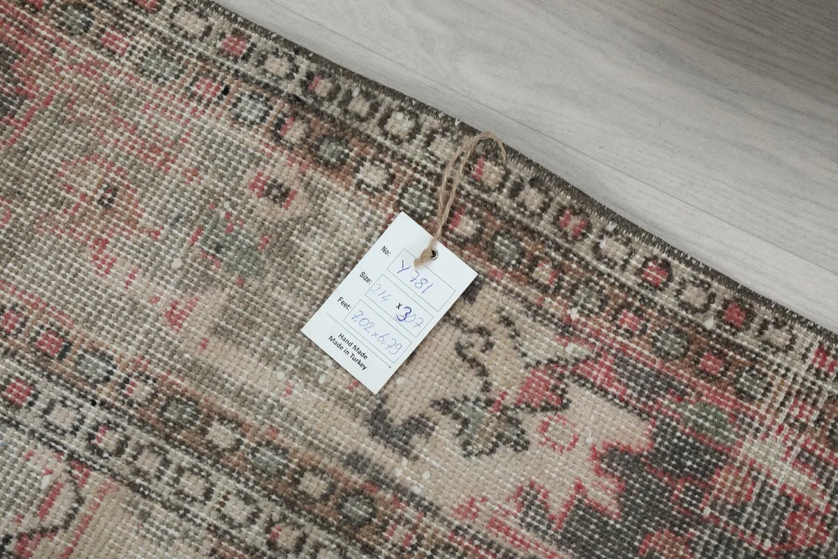 Detail of the rug's reverse side with a product tag attached