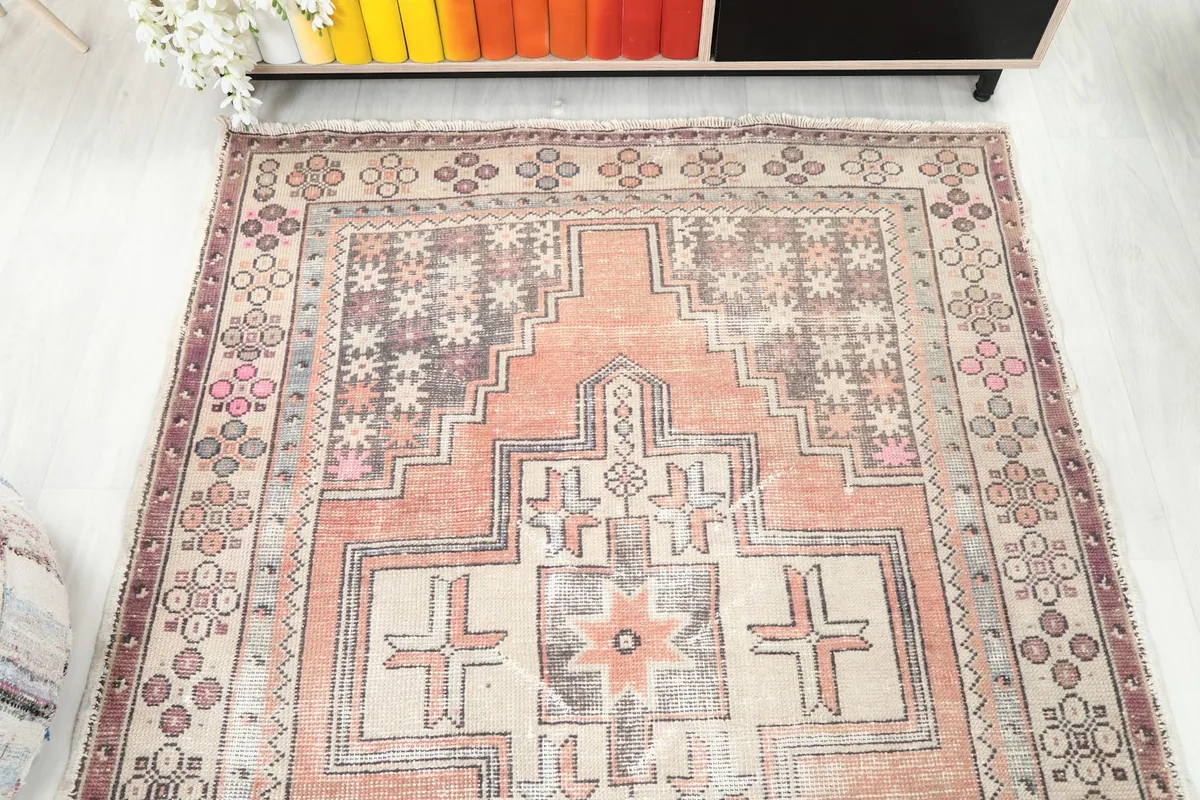 Overhead view focusing on the rug's full geometric design and color palette from a higher perspective.