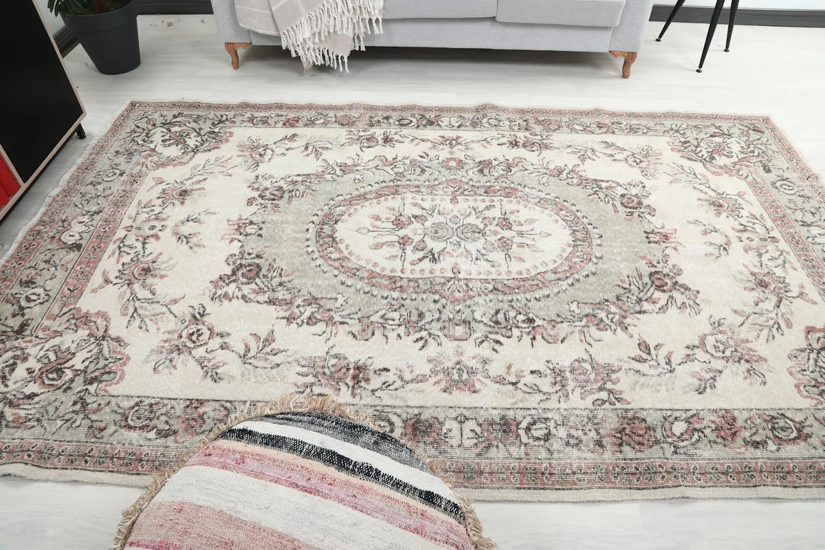 View of the vintage rug in a living space, from a slightly lower perspective