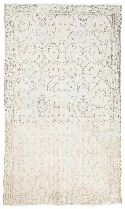 Full top view of the 6x10 beige vintage Anatolian rug with faded floral patterns