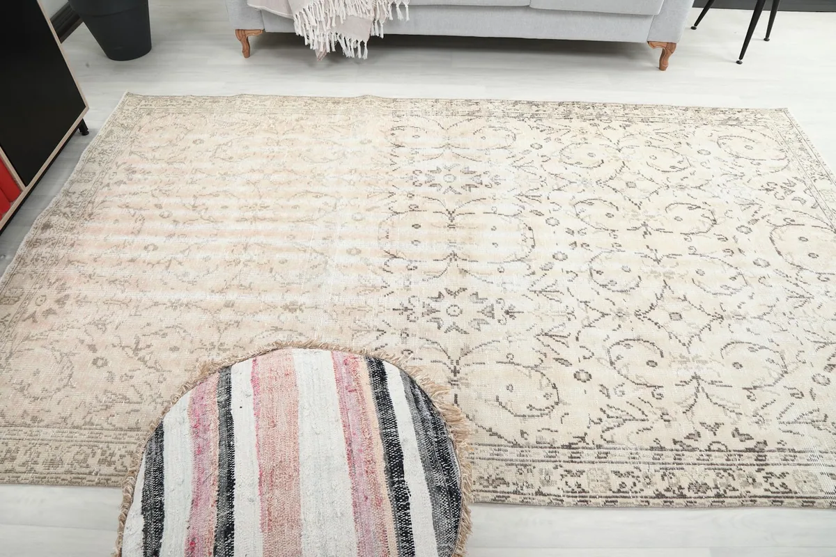 Room shot focusing on the rug's texture and how light interacts with its low pile