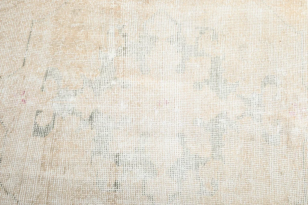 Detailed view of the low pile and subtle color variations across the rug's surface.