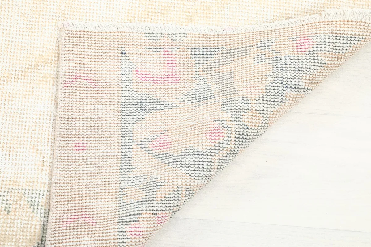 Underside of the rug, illustrating the hand-knotted construction and tight weave.