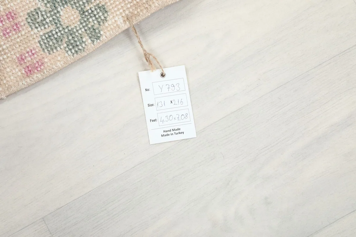Product tag displaying details like size and origin, attached to the rug's edge.