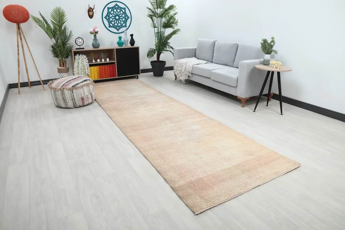 Overhead view of the beige runner rug in a contemporary living space, complementing light decor.