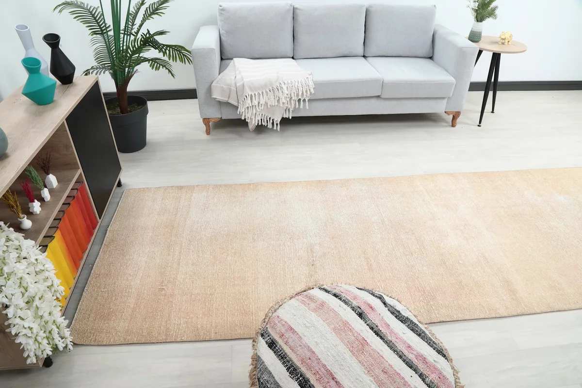 Wide room view of the runner rug, demonstrating how it anchors the seating area and adds warmth.