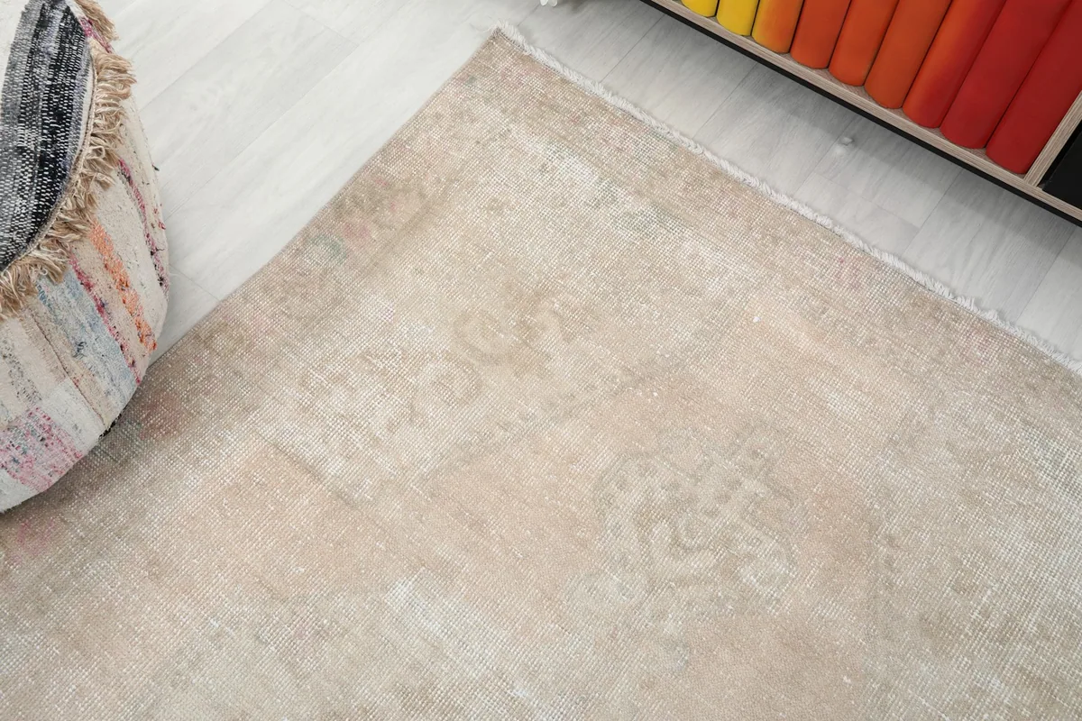 Corner view of the rug showing its subtle pattern and color variations