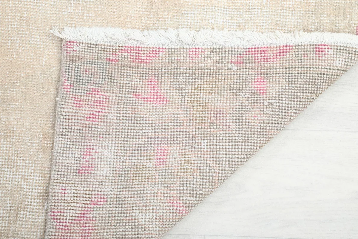 Detail of the rug's back and the hand-knotted construction