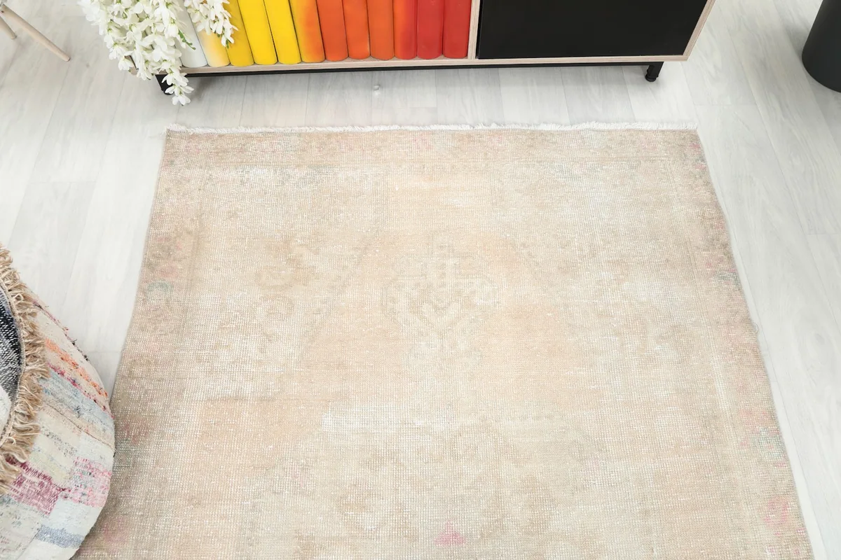 Overhead view of the rug in a room setting, highlighting its shape