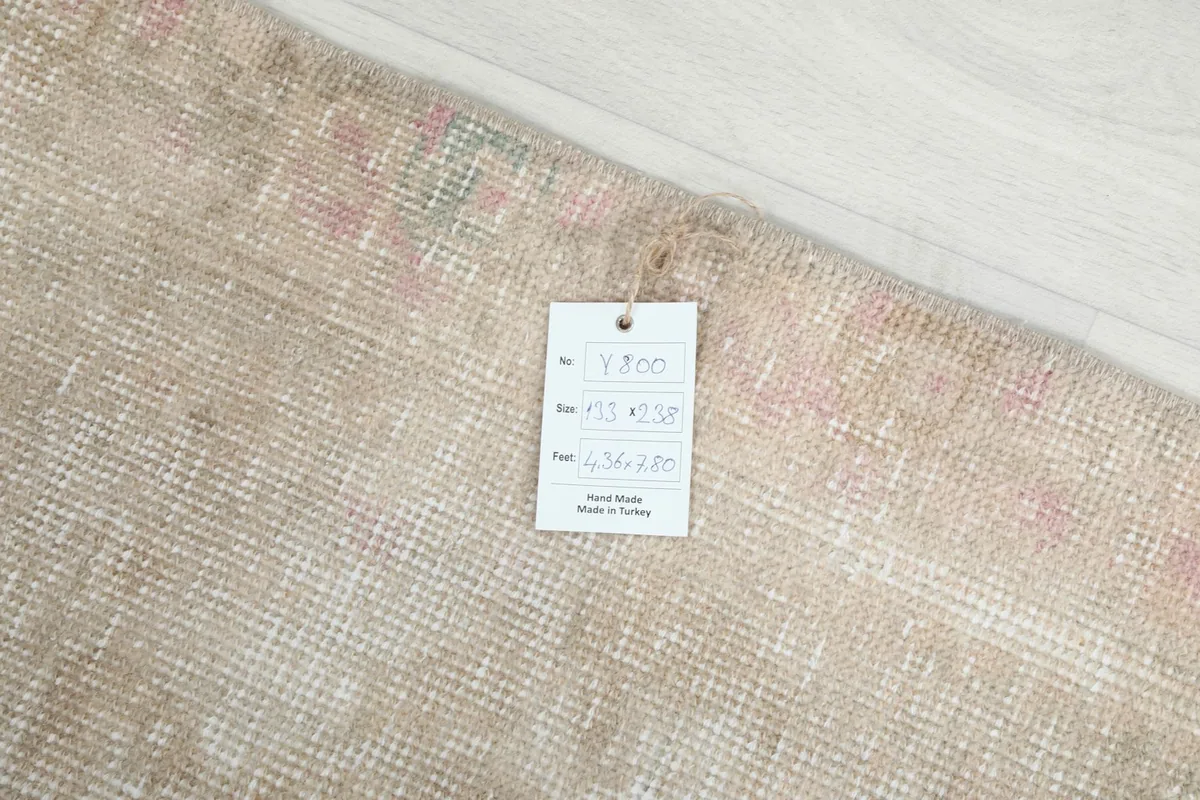 Rug tag displaying size and origin information on the back of the rug