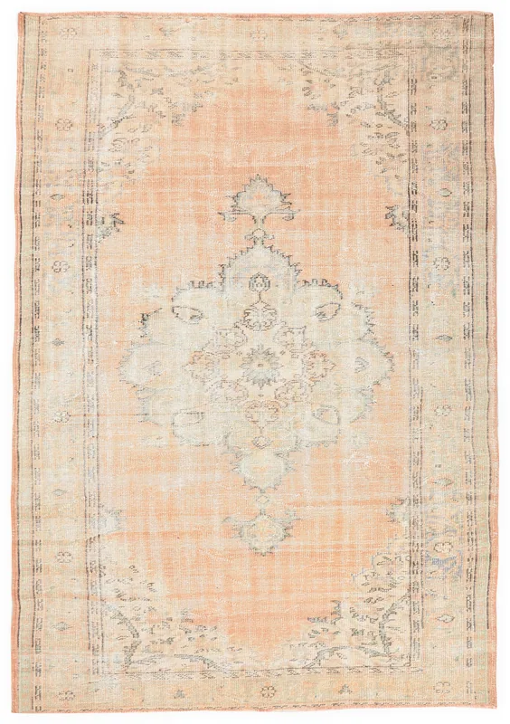 Full overhead view of the orange vintage Anatolian rug with a central medallion on a white background