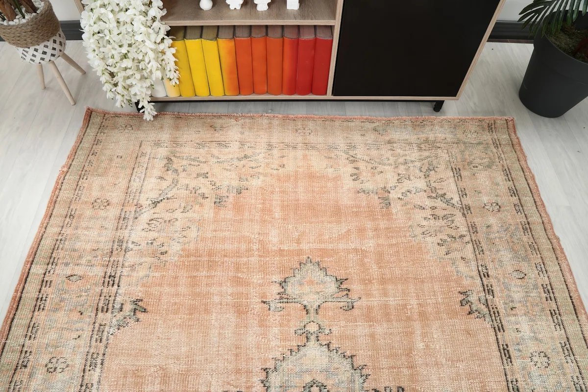 View from above showing the full width of the rug's top half, with its vintage character