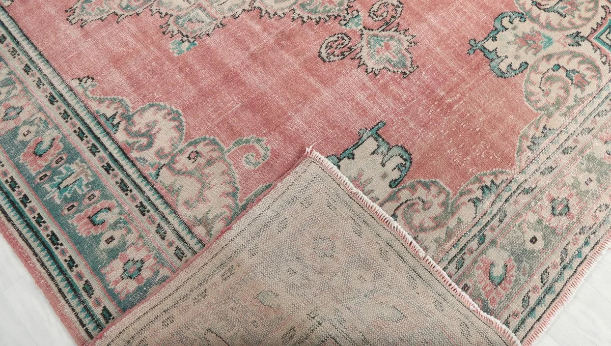 View of the rug's backside, showing the hand-knotted cotton foundation