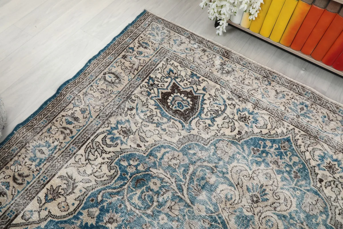 Top-down angle showing a corner of the rug and its detailed border