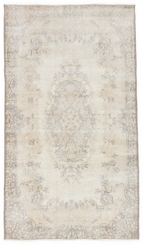 Full overhead view of the beige and gray vintage Anatolian rug on a white background