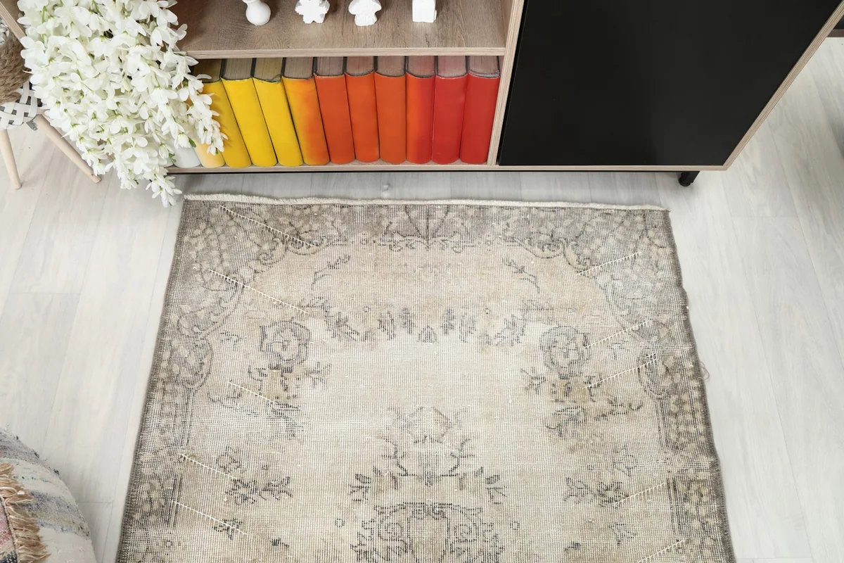 Overhead view of the rug's upper half, detailing the border and field patterns