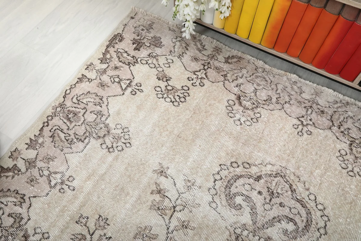 Overhead angle showing a corner of the rug with its border and main field