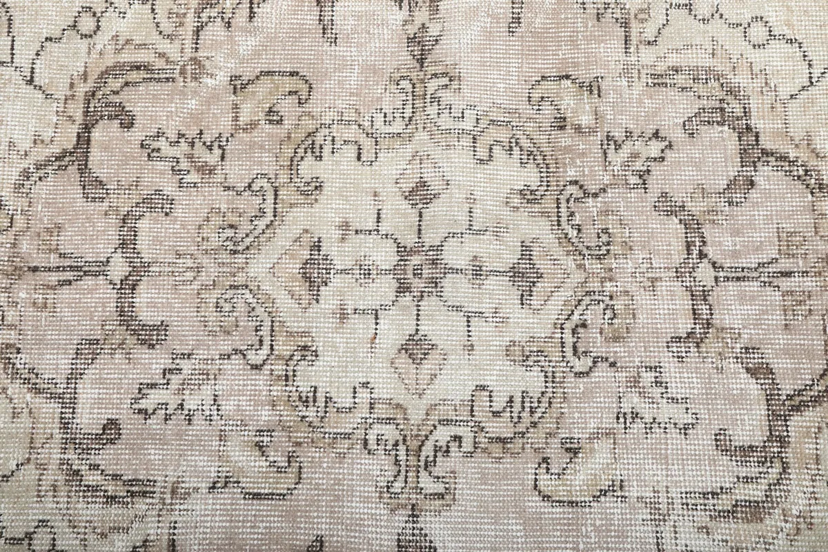 Intricate detail of the gray patterns and subtle color variations in the rug pile