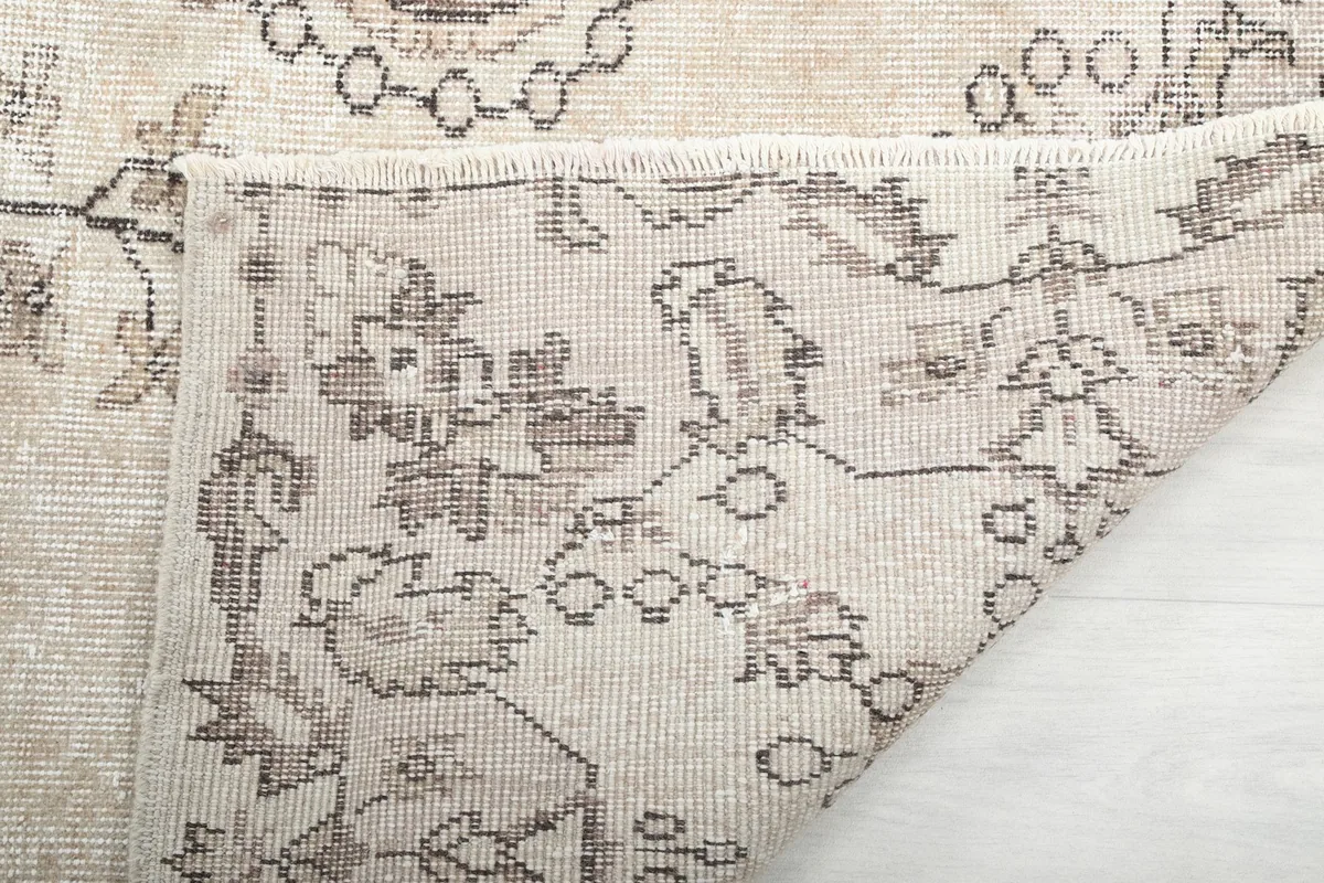 Underside view of the rug, revealing the hand-knotted construction and foundation