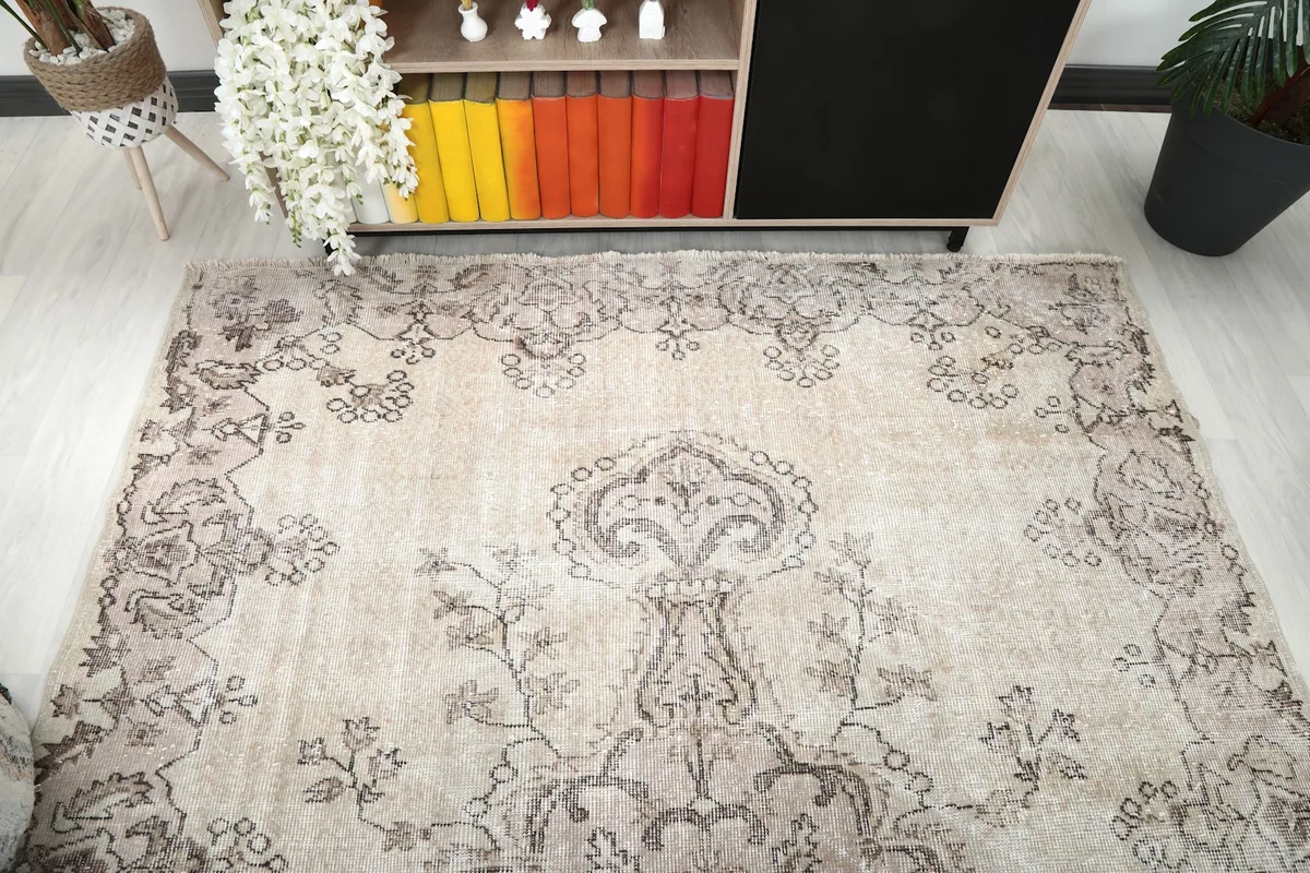 Overhead view of the vintage rug showcasing its full design in a room setting