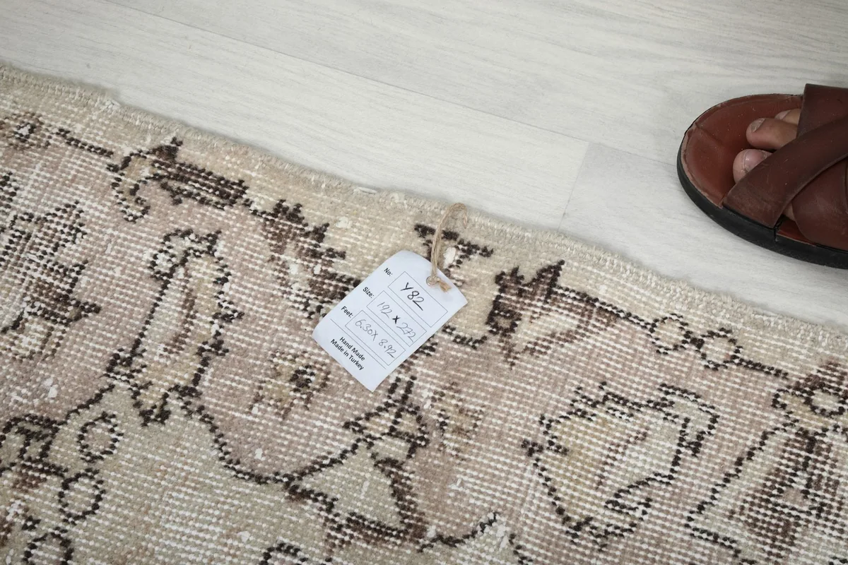 Close-up of the rug's edge and label, illustrating the texture and quality