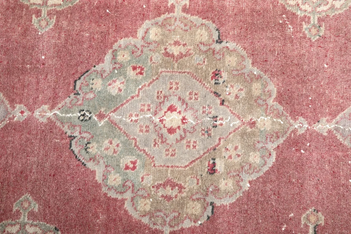 Detailed view of a single medallion, showcasing the intricate geometric design and colors