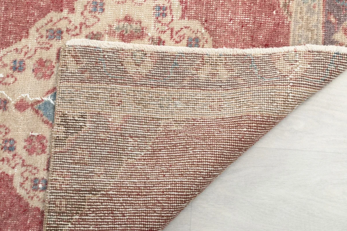 Reverse side of the runner rug, displaying the tight hand-knotting and foundation