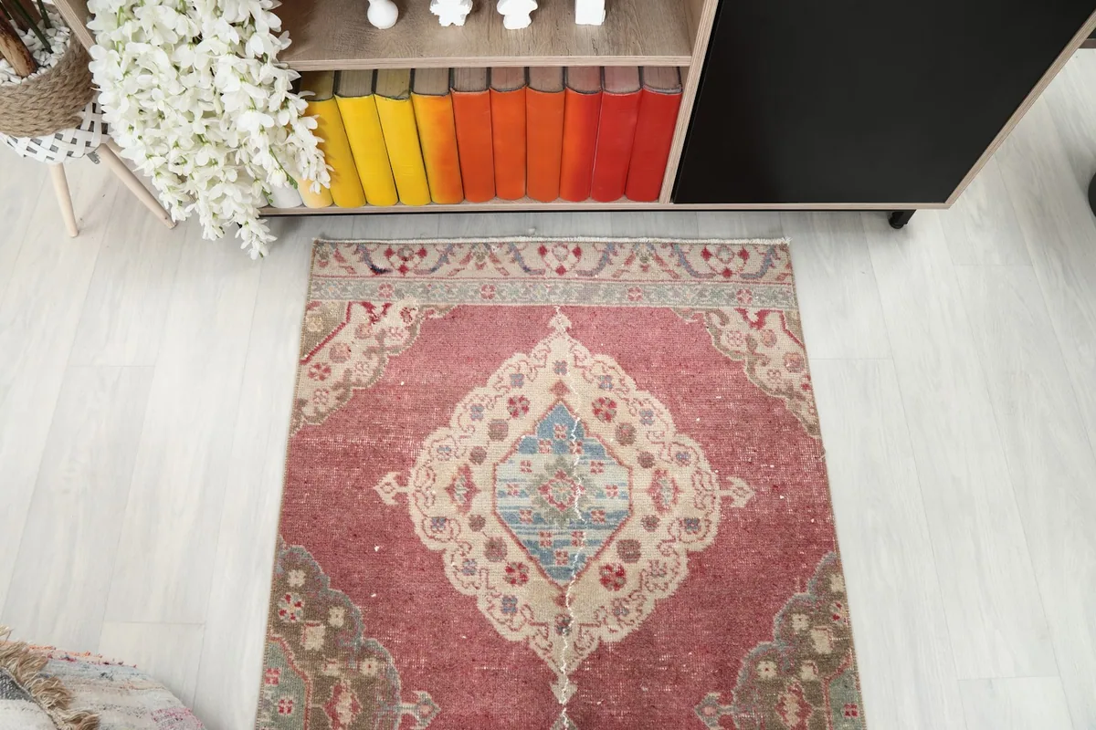 Overhead view of the runner rug's end section, revealing the medallion and border design