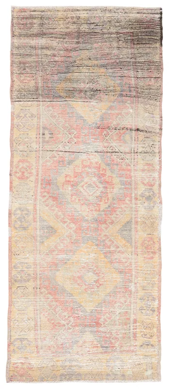 Full top view of the vintage Anatolian runner rug with rose, beige, and gray geometric patterns