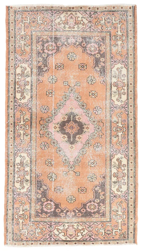 Full overhead view of the rust and pink medallion vintage Anatolian rug