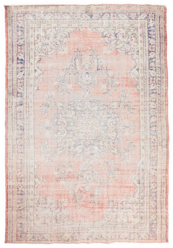 Full top view of the vintage Anatolian area rug with rose field and blue border
