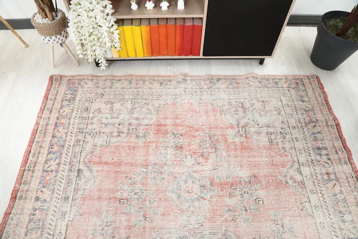 Overhead view of the vintage rug showcasing its full design and colors