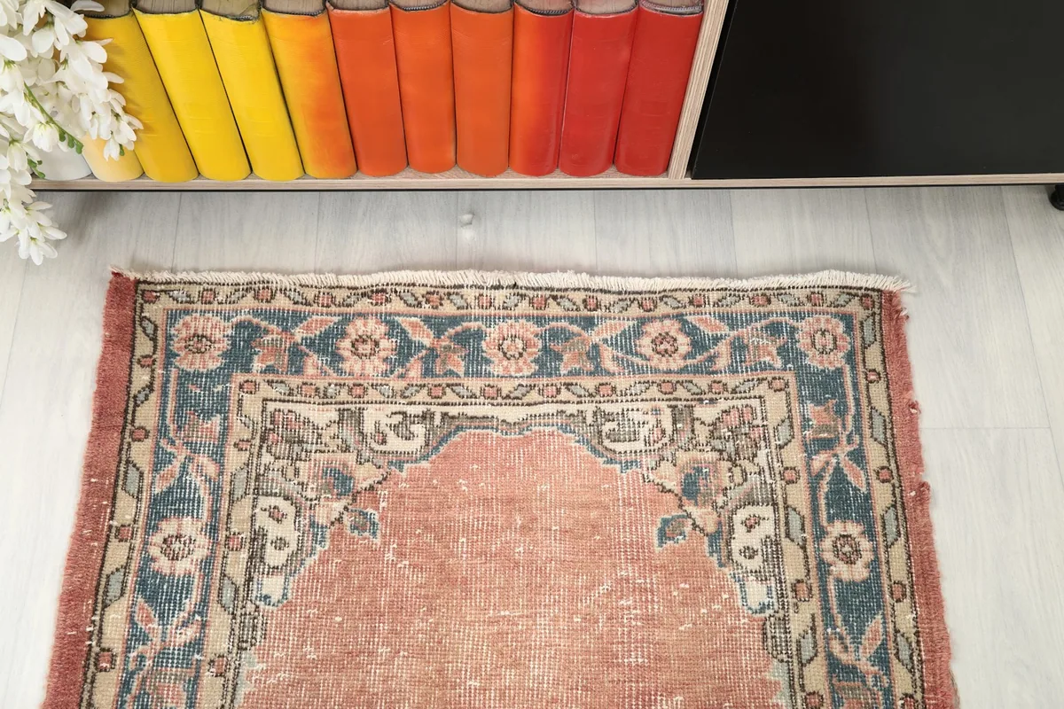 Overhead view of one end of the runner rug, highlighting the border and design near the edge.