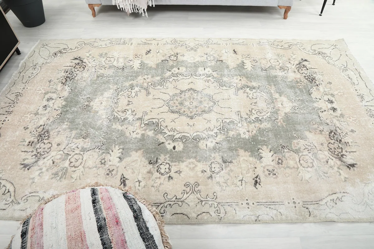 Wide overhead view of the rug in a room, showing its scale and overall impact.
