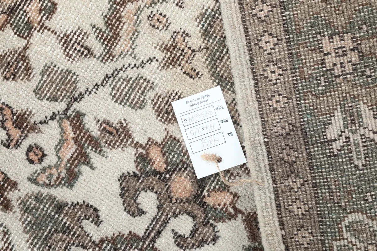 Close-up of the rug's low wool pile and the texture of the hand-knotted weave