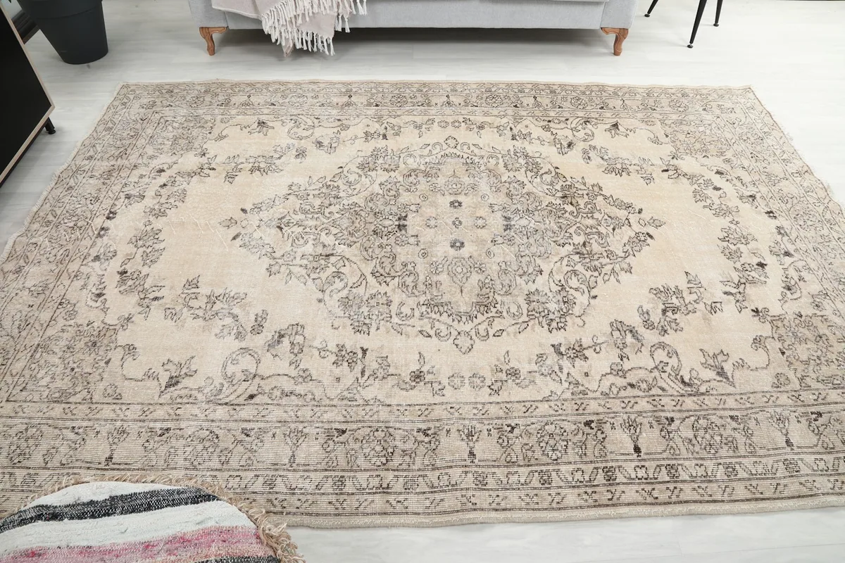 Direct overhead view of the rug, emphasizing the full medallion and field pattern in the room setting.