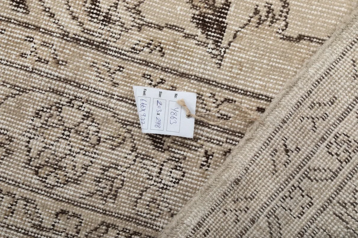 Detail of the rug's back with a tag, illustrating the tight weave and craftsmanship.