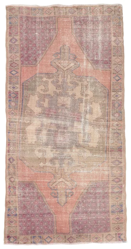 Top view of the 4'4" x 8'10" vintage Anatolian rug with rust, rose, and beige geometric patterns