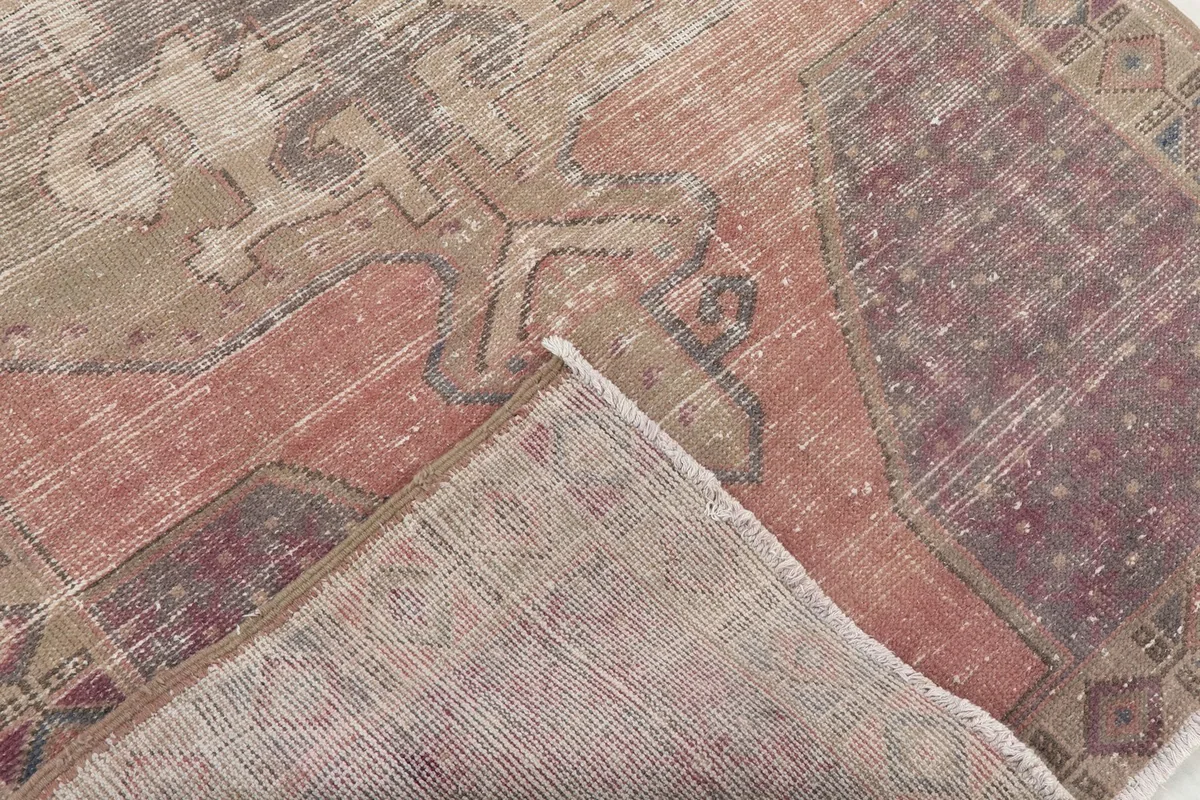 Underside view of the hand-knotted rug, revealing the cotton foundation and construction