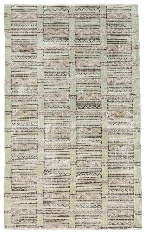 Full top view of the olive geometric tribal rug on a white background