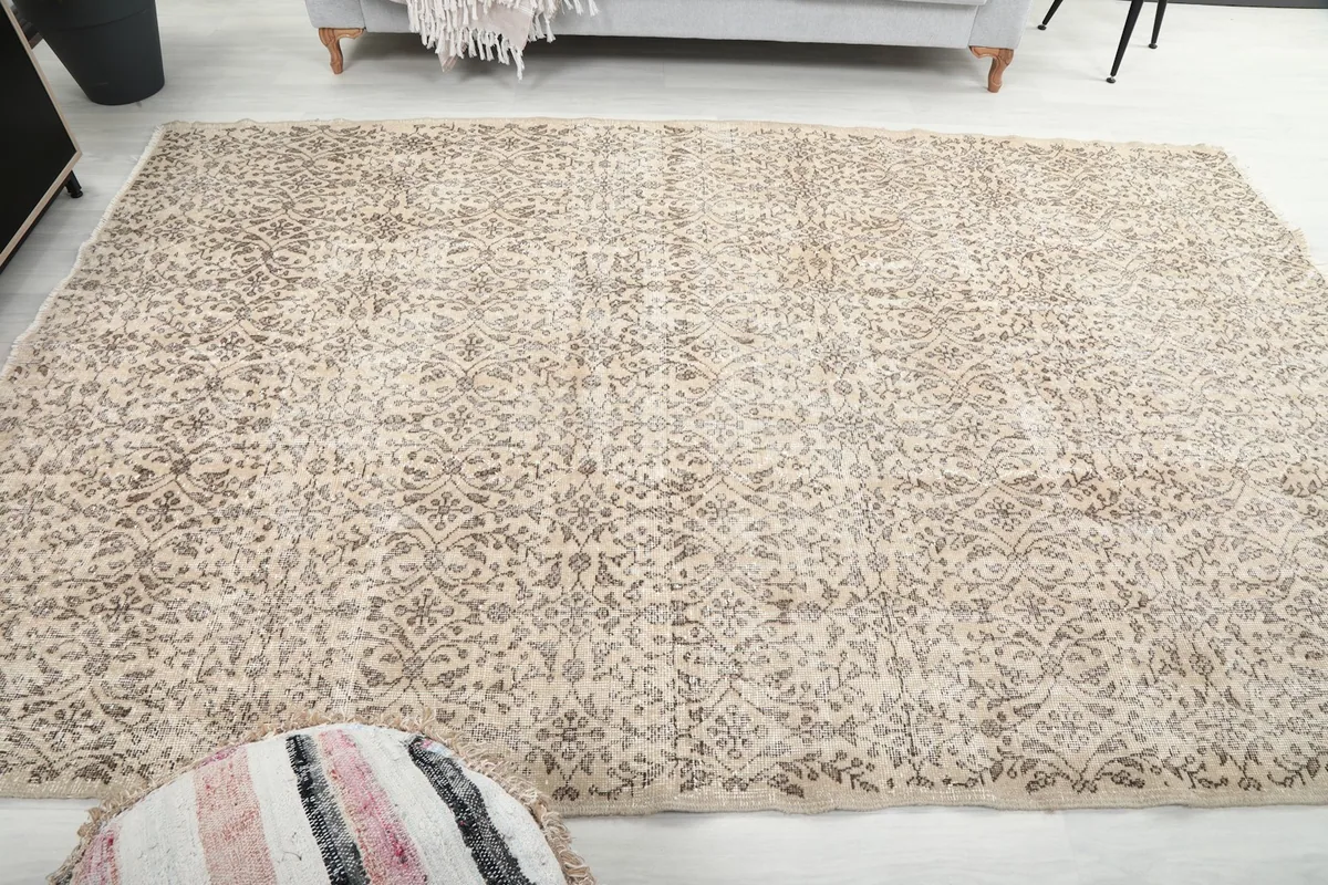 View of the rug in a living room, showing its size and how it anchors the seating area.
