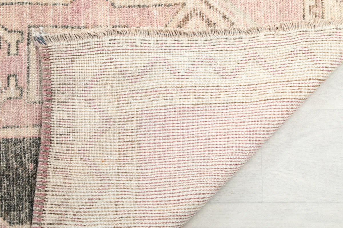 Underside of the Faded Rose Diamond Tribal Runner showing the cotton foundation