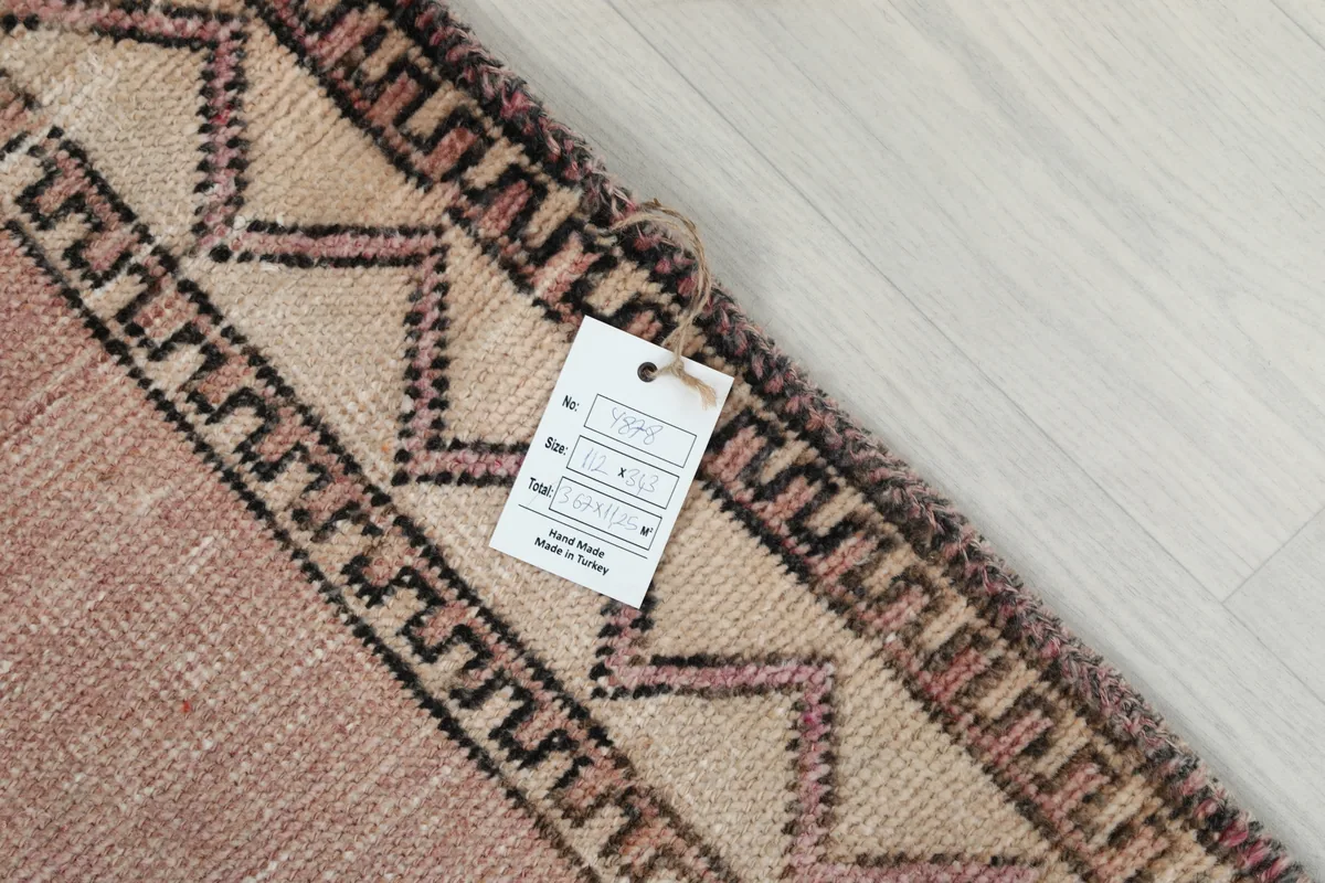 Care tag attached to the Faded Rose Diamond Tribal Runner