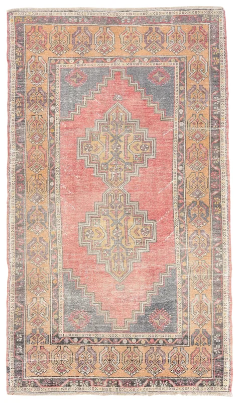 Full overhead view of the rose and gray geometric Anatolian rug