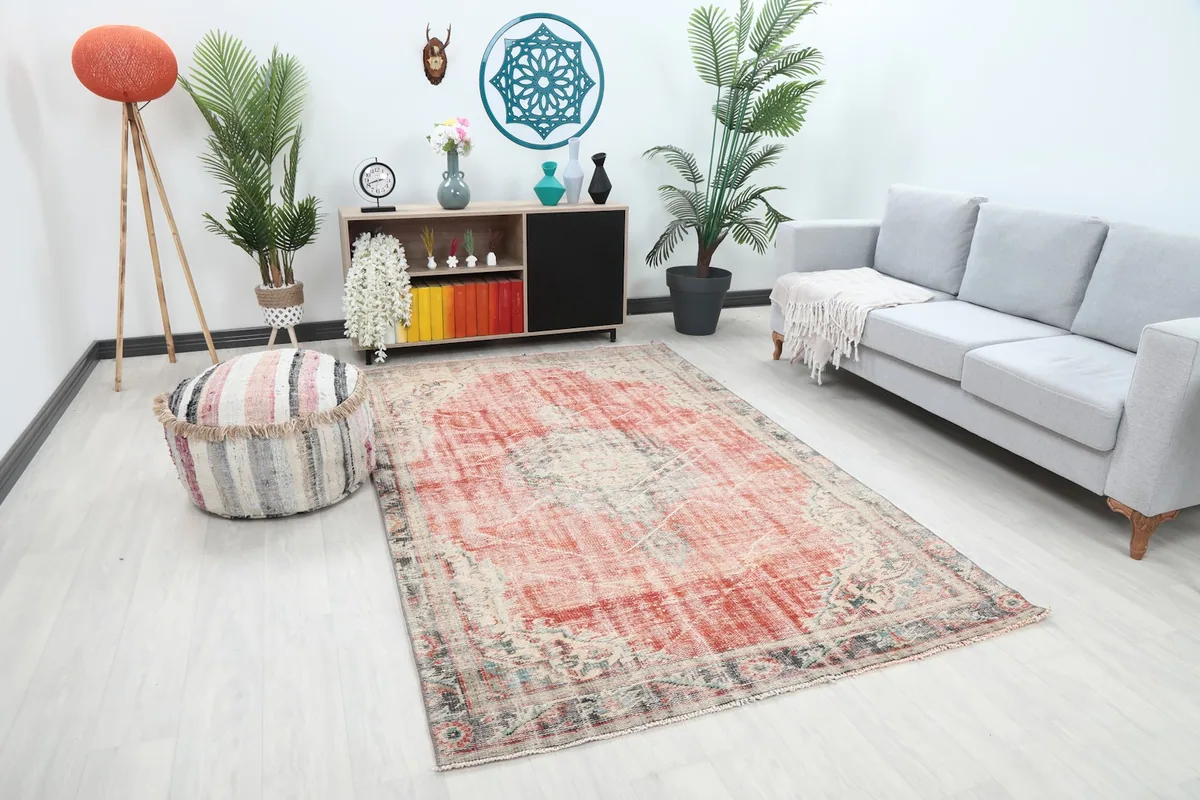 Wide shot of the rust and beige medallion rug furnishing a modern living space.