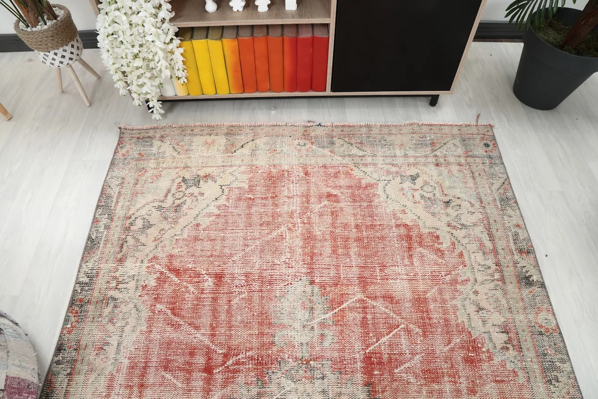 Overhead view focusing on the upper half of the rug, showing its placement in a room.