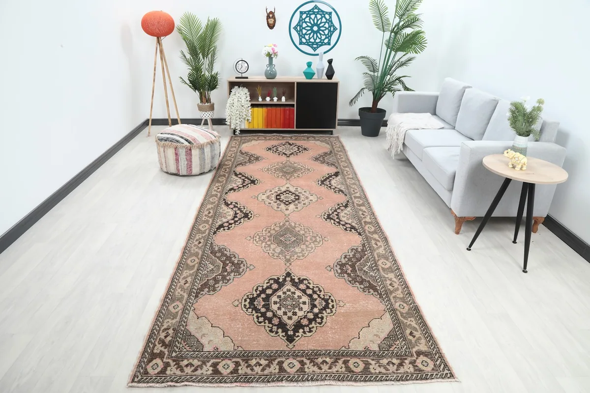 Rose runner rug with brown and black patterns in a modern living space
