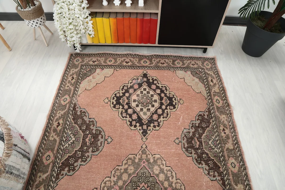 Overhead view of one end of the rose runner rug in a room setting