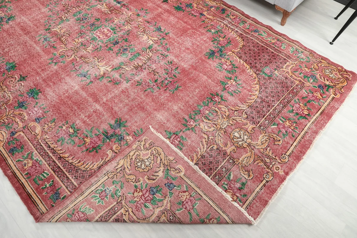 Detail of the rug folded back, showing the back of the hand-knotted wool pile